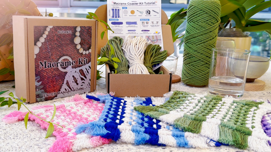 Hands unboxing a BUFANTL macrame kit showing printed tutorial booklet, pre-cut cotton cords, wooden beads, and a half-finished handmade piece on a wooden desk